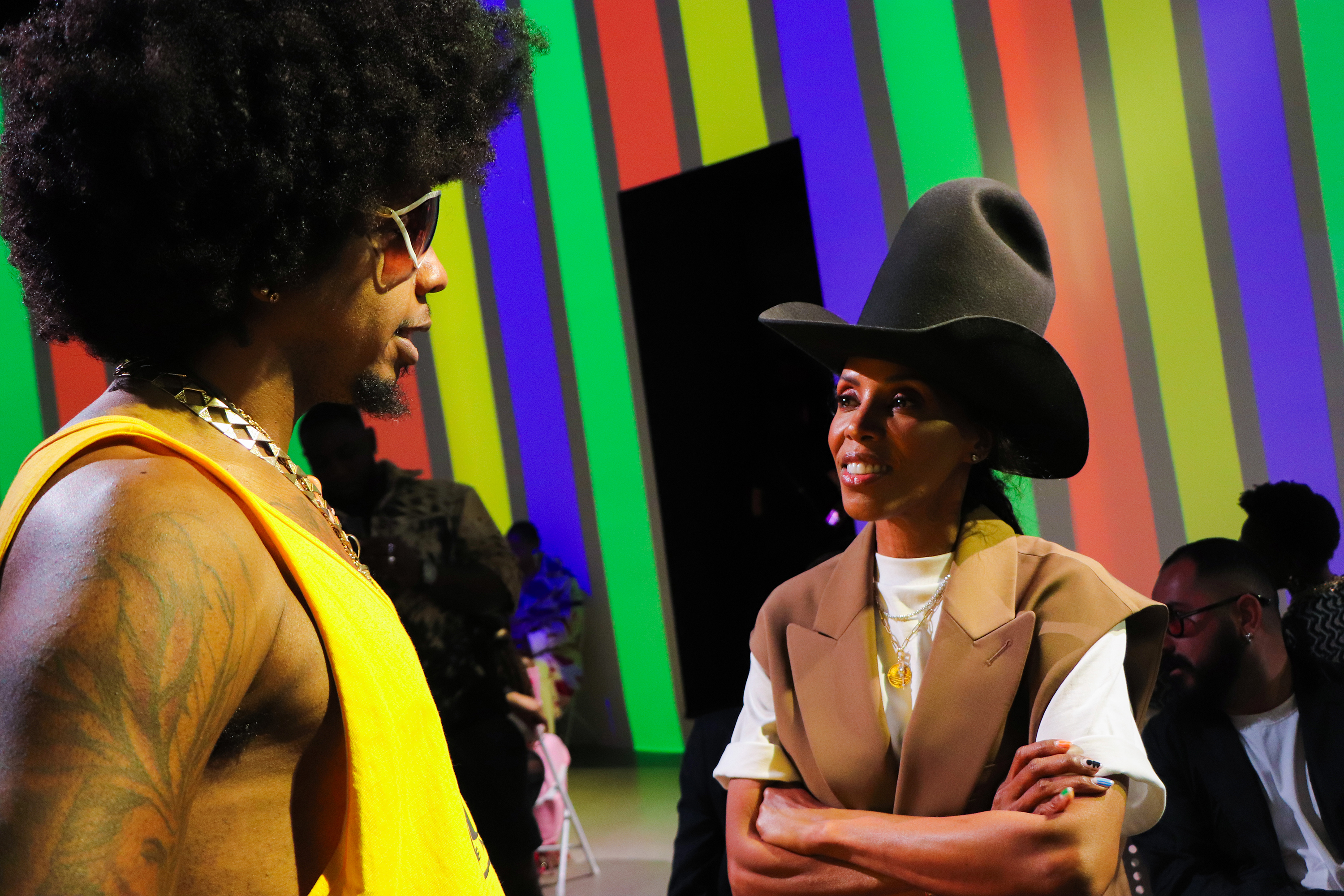 June Ambrose wearing a large cowboy hat speaking to a man at the Romeo Hunte 2024 NYFW fashion show