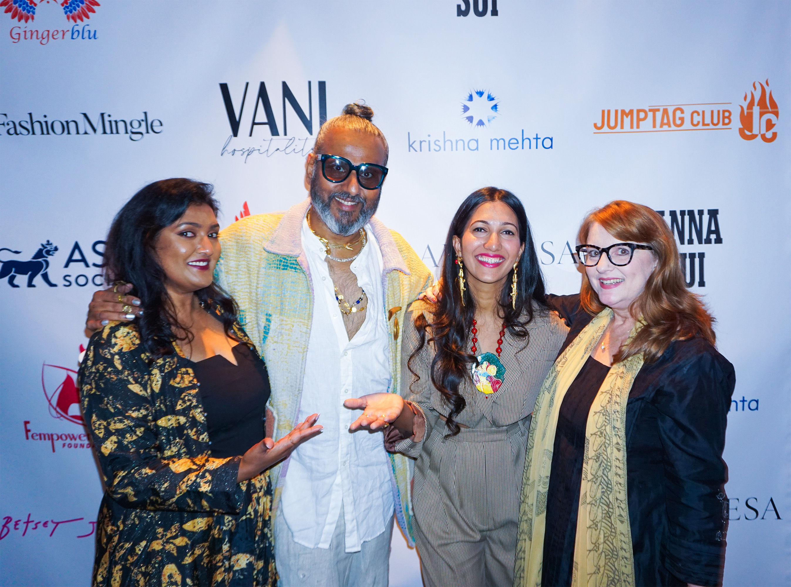 Ajay Shrivastav, Melissa Shea, Poonam Thimmaiah, Sneha Andani posing together in front of a step and repeat banner