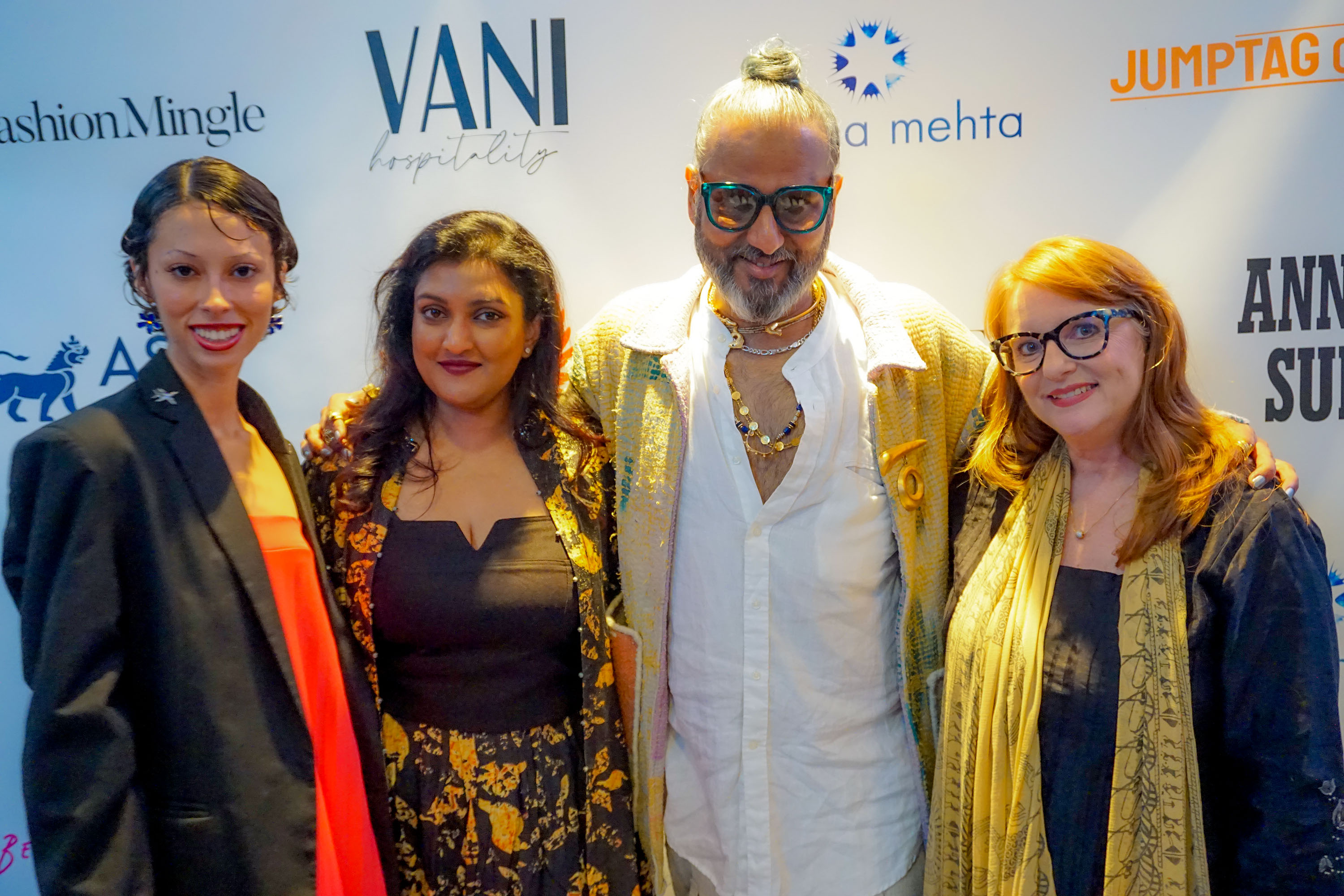 Ajay Shrivastav, Melissa Shea, Victoria Roberts, Sneha Andani posing in front of a step and repeat banner