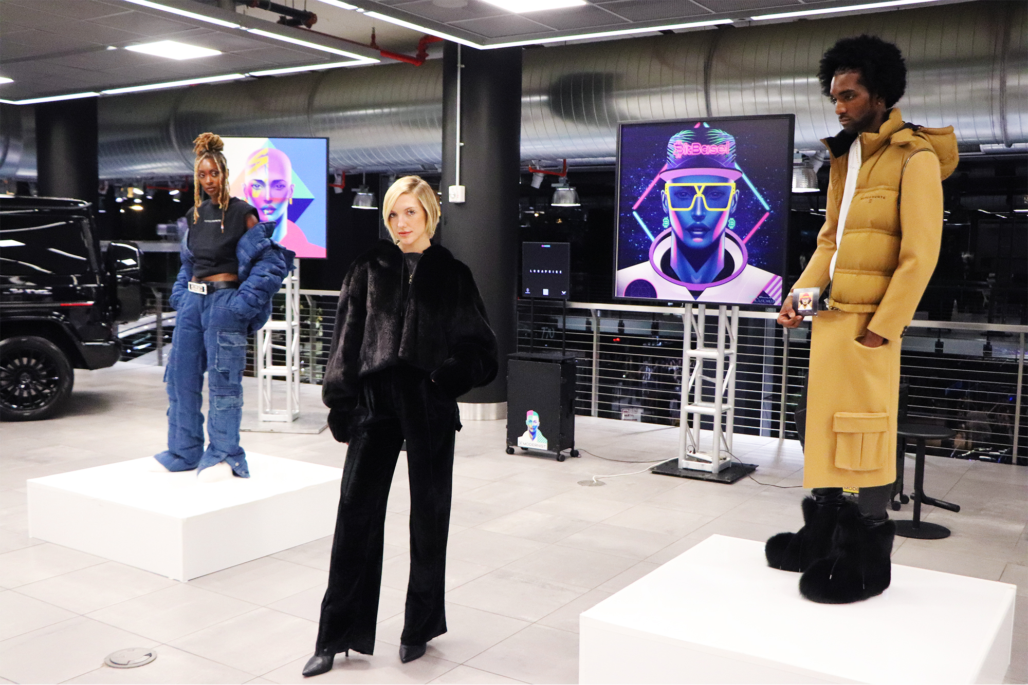 3 models wearing Romeo Hunte's clothing line at a fashion show