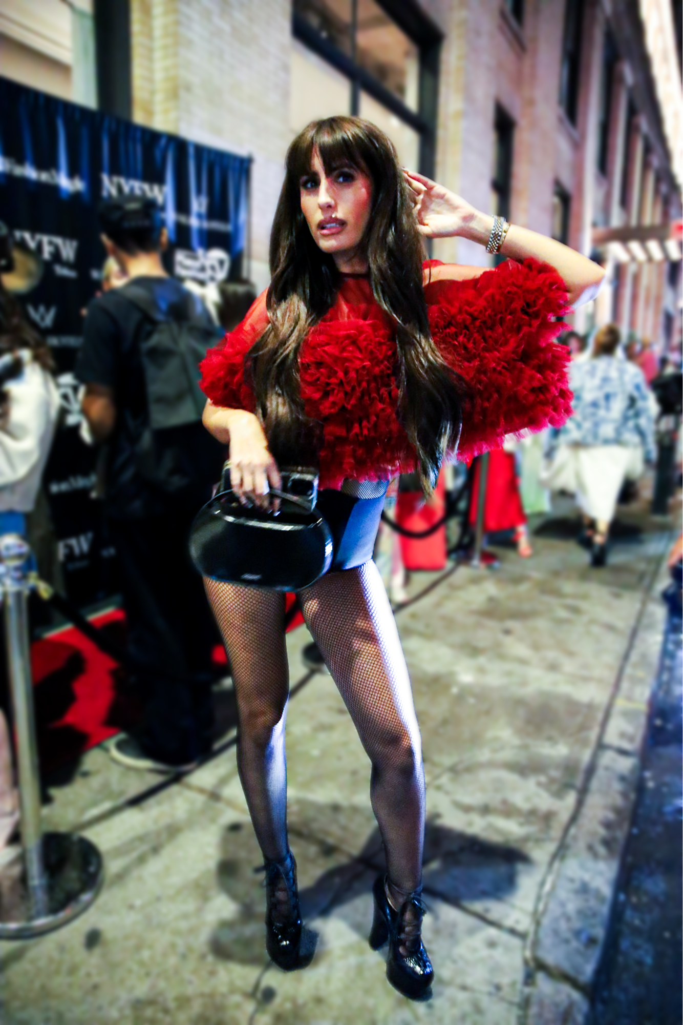 Didi J posing outside in line at Walker Hotel fashion show